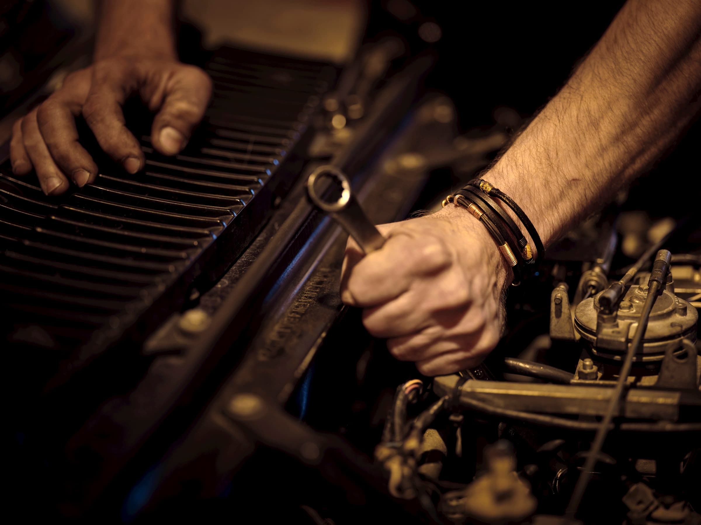 Experienced auto mechanic working on vehicle engine repair at Weekend Auto Pros in Huntington Beach